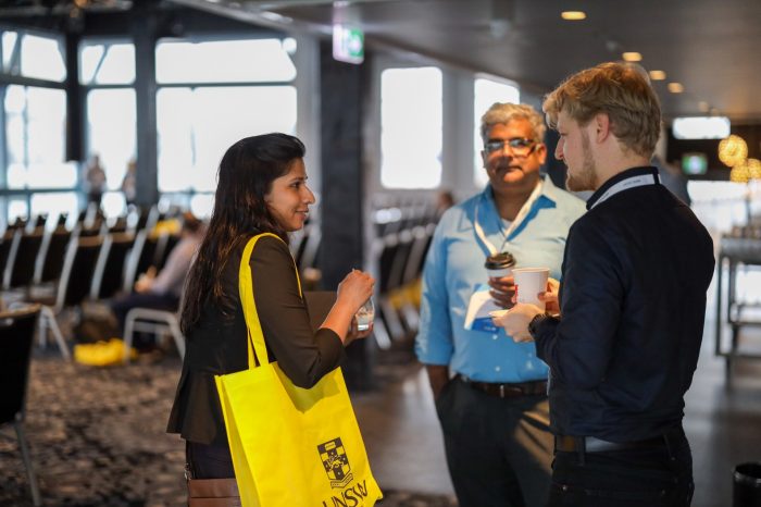 People networking at the symposium