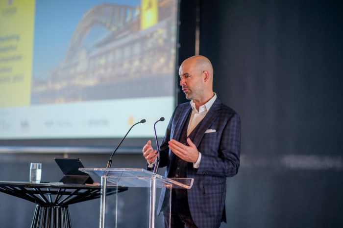 Keynote speaker presenting at a lectern