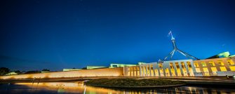 Facade of new parliament house in Canberra at night